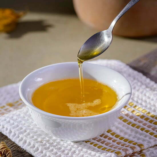 Ghee enthält keinen Milchzucker Flüssige geklärte Butter, Ghee